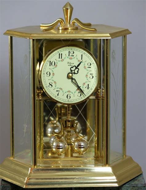 Bulova B8818 Tristan I Clock, Brass Finish 598 5160 59. . Elgin battery operated anniversary clock manual